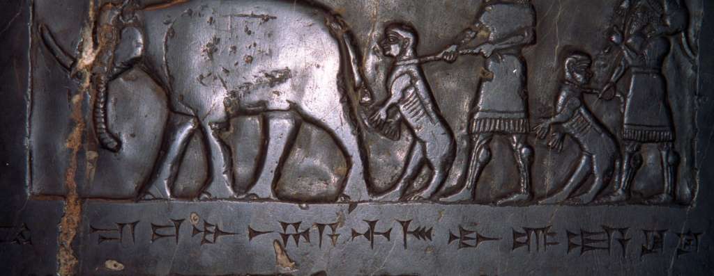 British Museum Top 20 14-2 Black Obelisk Close Up 14. Black obelisk of Shalmaneser III, 825BC, Nimrod (northern Iraq), 198cm high. Here is a close up of the third panel showing the tribute of the country of Musri (probably Egypt), consisting entirely of animals led or driven by attendants dressed in knee-length garments.